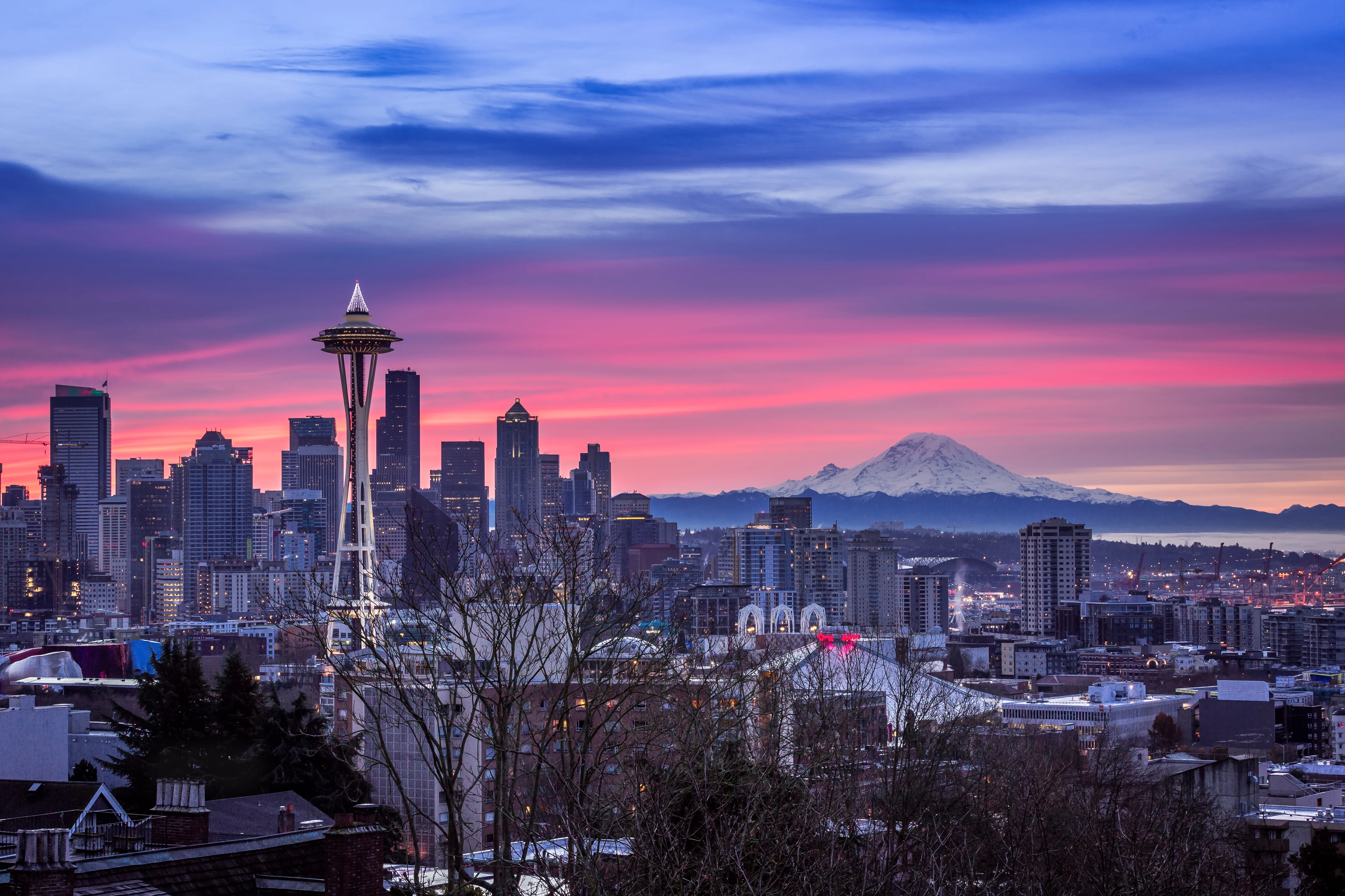 Seattle skyline and the Space Needle at sunset, Mount Rainier behind